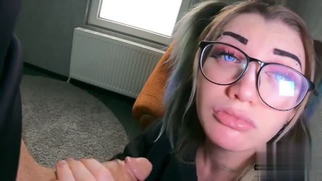 A Cute Girl in Glasses gives a Blowjob and Gets a Lot of Cum on her Face